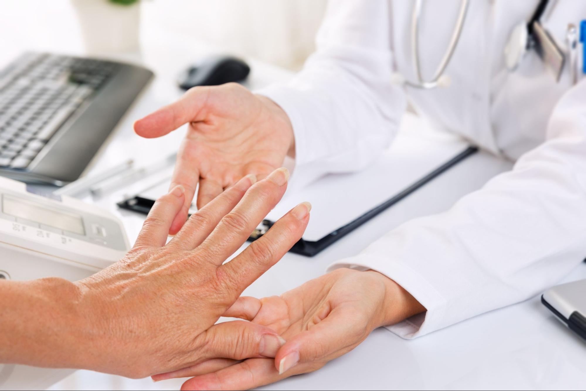 hand specialist doctor examining fingers